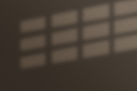 Window pane shadow in a rectangular grid on a surface.