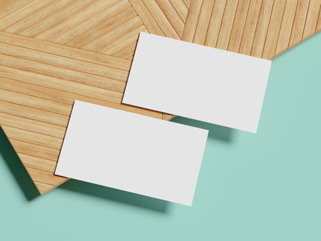 A business card mockup placed on a wooden backdrop with a soft, diffused shadow, offering a sleek, modern design in a fresh and vibrant color setting.の写真素材