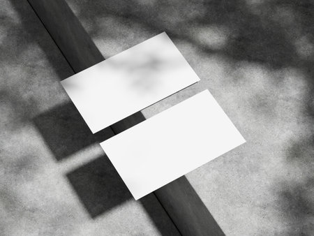Sleek business card design displayed on a clean concrete background.の写真素材