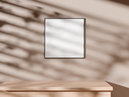 Neutral frame mockup on wall casting light and shadow patterns.の写真素材