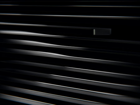 Abstract close-up of stacked metallic panels with smooth curves and black backdrop.