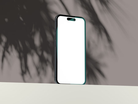 Clean mobile phone mockup with empty screen and soft shadow ambiance.の写真素材