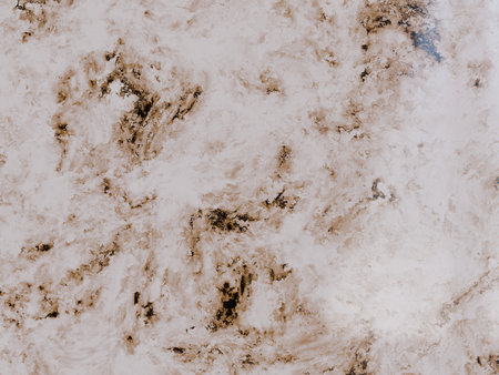 Light brown marble texture background, mottled veins and subtle highlightsの写真素材