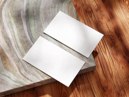 Minimalistic business card mockup with marble and wood textures for branding projects.の写真素材