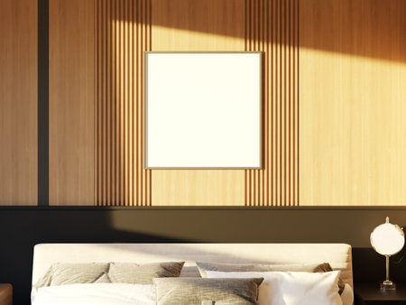 Bright bedroom with wooden wall and a spacious frame for art display.の写真素材
