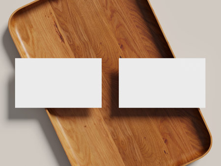 Business card mockup on a wooden tray, featuring a clean design with shadow effects.の写真素材