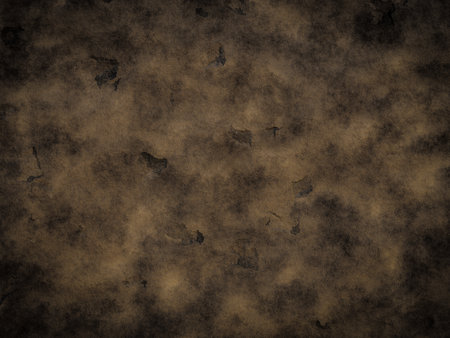 A rough cement rock surface with dark patches and faded areas.の写真素材