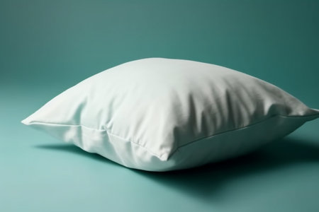 white pillow on a turquoise background, soft focus, close-upの素材