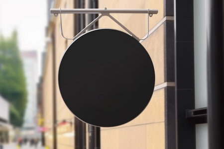 Blank black signboard hanging on the wall of a cafe.の素材