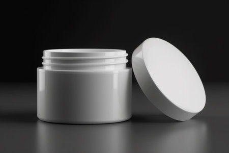 White cosmetic cream jar mockup on black background. 3D renderingの素材