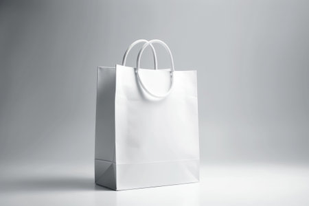 Blank white paper shopping bag on white background. 3d renderingの素材