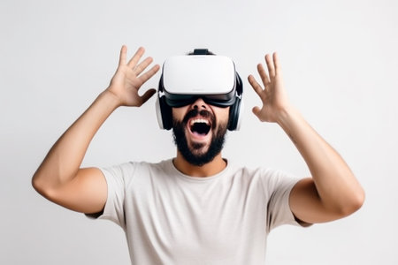 Young man wearing virtual reality goggles. Isolated on white background.の素材