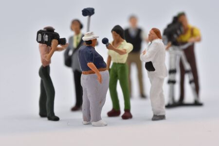 miniature people film crew is taking an interview scale 1:87の写真素材