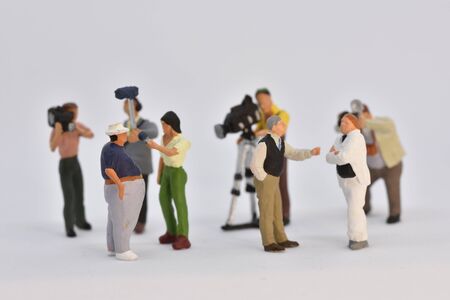 miniature people film crew is taking an interview scale 1:87の写真素材