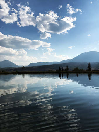 Pond with Mountain in Backgroundの写真素材