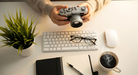 Creative flat lay photo of workspace with camera, keyboard, notebook and coffee cup on white backgroundの素材