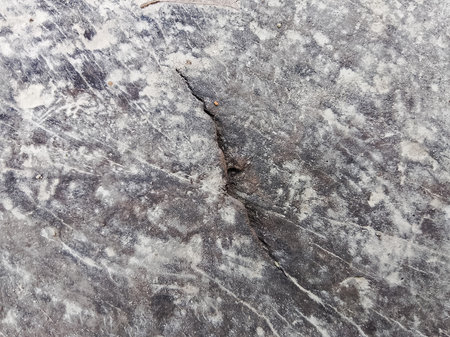 Old grunge texture background. Floor surface with cracks and scratches.の写真素材