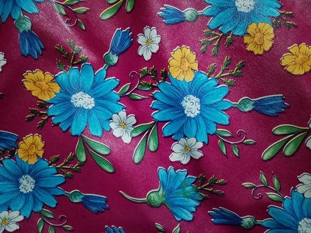 Texture, background, pattern. Fabric with a pattern of blue and yellow flowersの写真素材