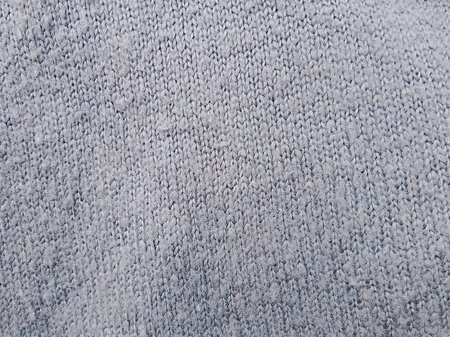 Texture of gray knitted fabric as a background, close-upの写真素材