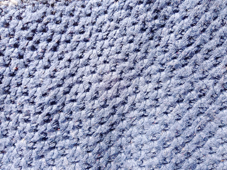 Texture of knitted fabric as a background, closeup of photoの写真素材