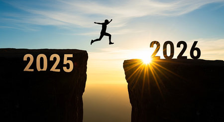Person leaping across a chasm from 2025 to 2026 at sunsetの素材