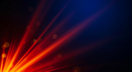 Abstract rays of light with bokeh effect on dark blue backgroundの素材