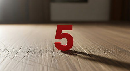 Number 5 on a wooden floor. 3D illustration. Selective focus.の素材