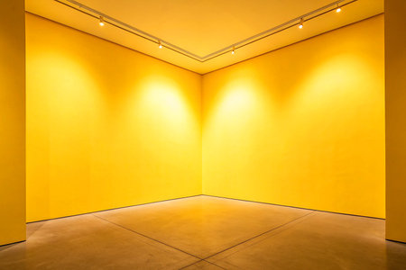 Yellow wall and floor with spotlights in modern gallery interior background.の素材