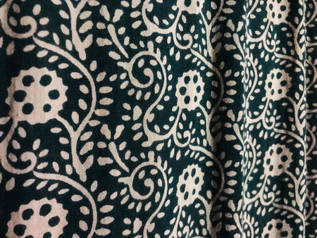 Texture, background, pattern. Silk fabric with a pattern of flowers