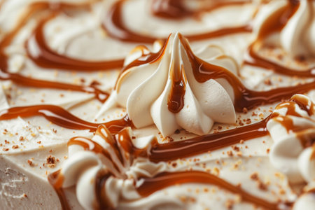 close up of a chocolate cake with whipped cream and caramel on topの素材
