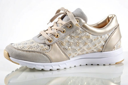 Stylish elegant trendy designer fashionable women's sneakers isolated on white backgroundの写真素材