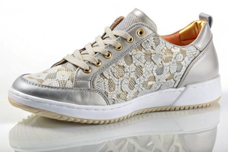 Stylish elegant trendy designer fashionable women's sneakers isolated on white backgroundの写真素材