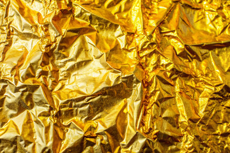 Gold foil shiny paper texture background for wall paper decoration elementの写真素材