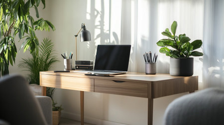 Modern workplace with laptop and stationery on wooden table in home office