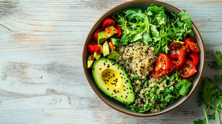 Buddha bowl with quinoa, avocado, tomatoes and arugula