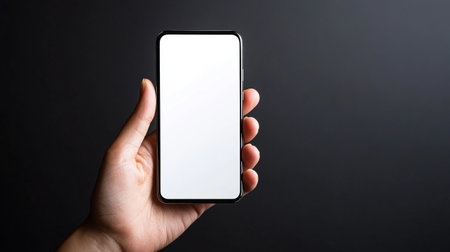 female hand holding smartphone with blank screen on black background, mockup