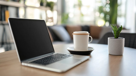 Laptop and coffee cup on wood table in coffee shop, stock photo