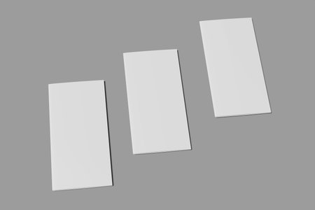 Blank white brochure mockup isolated on grey background. 3D rendering series 11の写真素材