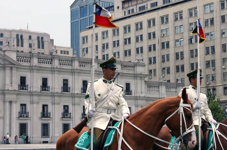 Presidential guards on horses at the parade grounds of Palacio de La Moneda Santiago Chile.のeditorial素材
