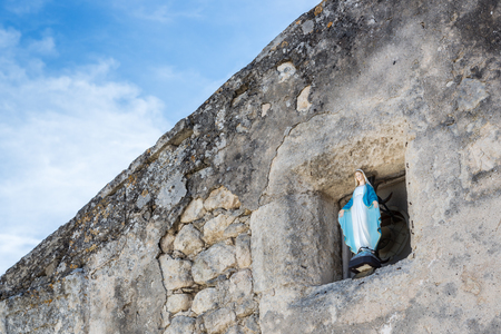 Virgin Mary statue at the procession way - symbol of love and kindnessの写真素材