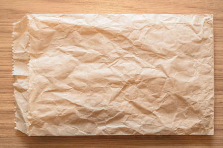 Brown Disastrously Bag on wooden backgroundの写真素材