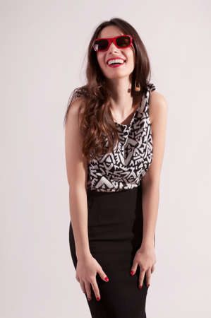 Pretty laughing woman in classic clothes portrait