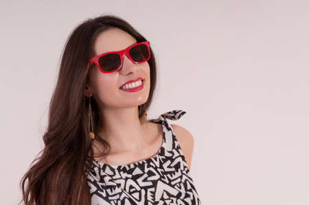 Beautiful white woman portrait classic style with red sunglassesの写真素材