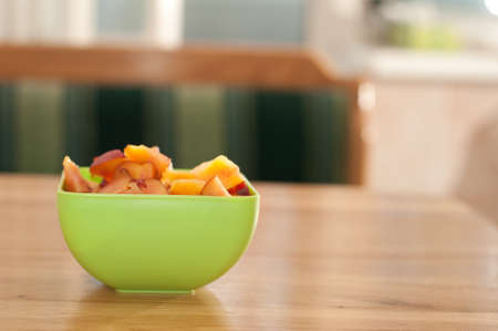 Bowl with porrige and fruits for breakfast on wooden tableの写真素材