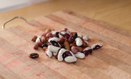 Heap of kidney beans on wooden kitchen board