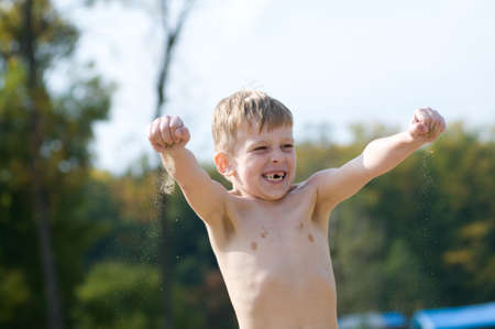 Happy little boy atchive his goal and happy about itの写真素材