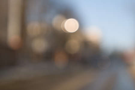 Traffic abstract background with blurry buildings, street signs and carsの写真素材