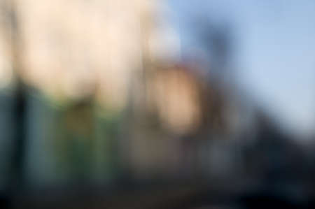 Traffic abstract background with blurry buildings, street signs and carsの写真素材