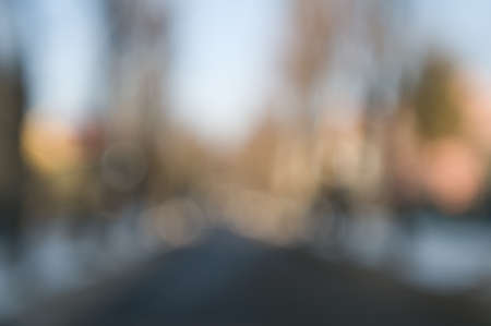 Traffic abstract background with blurry buildings, street signs and carsの写真素材