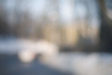 Abstract background with blurry buildings, street signs and cars in spring grey tonesの写真素材